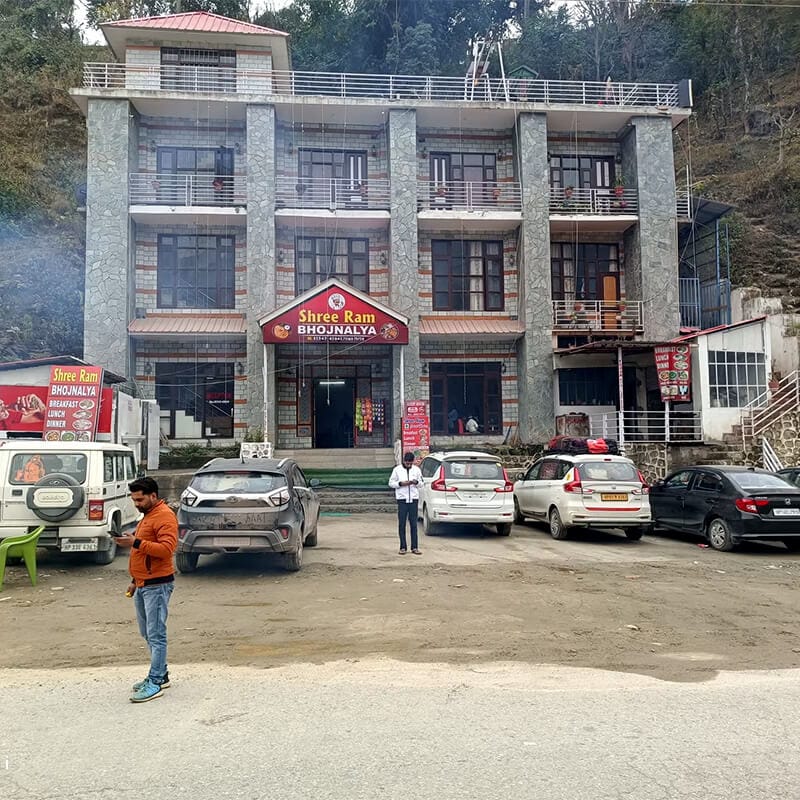 Roadside Exterior View with Ample Parking Space at Shree Ram Hotel